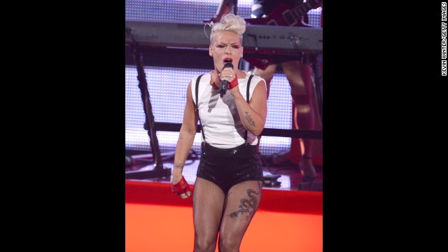 The real girl with the dragon tattoo, Pink, shows off her ink while performing at the 2012 MTV Video Music Awards.
