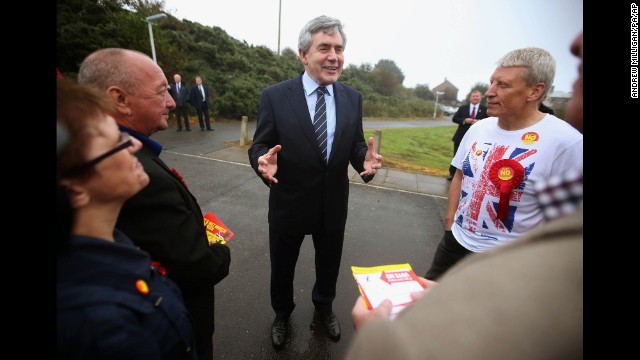 Former British Prime Minister Gordon Brown talks to pro-union campaigners outside a polling station in Queensferry, Scotland, on September 18.