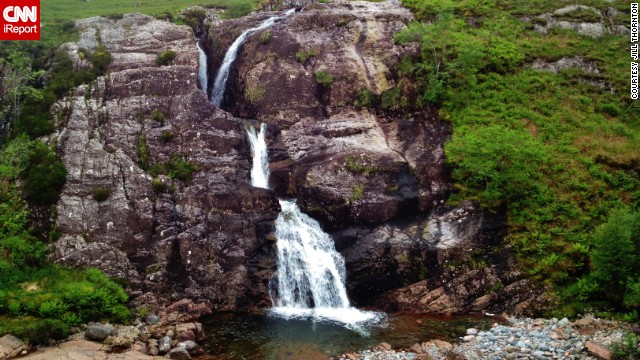 A waterfall splashes down the slopes of scenic <a href='http://ift.tt/XlS2n6'>Glen Coe</a>, popular for both long walks and bus tours.