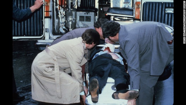 Brady is placed into an ambulance shortly after being shot. He suffered a head wound and was left partially paralyzed.
