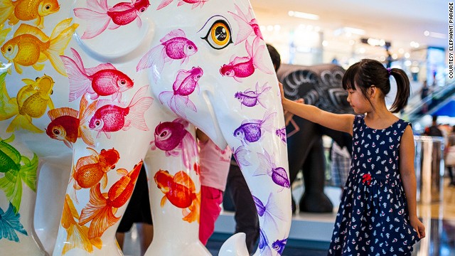 Artist Noppawan Nusansiri designed this colorful elephant to represent fish, a symbol that denotes positive feng shui in Asia. The statue is part of the "Elephant Parade" exhibit currently on display around Hong Kong.