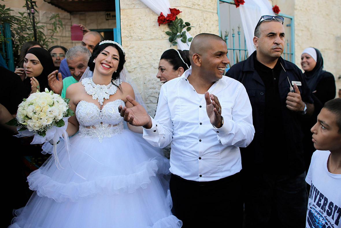 Mahmoud Mansour and his bride Maral Malka celebrate before their wedding in Jaffa, south of Tel Aviv. More than 200 far-right Israeli protesters tried to disrupt the wedding of a Jewish woman and a Muslim man
