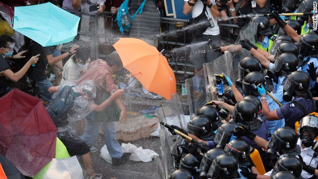Police and protesters clash during a tense stand-off with thousands of student demonstrators, recently joined by the like-minded Occupy Central movement, on September 28.