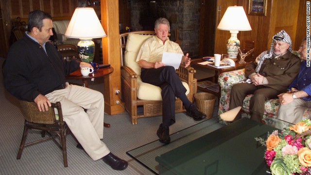 Clinton meets with Israeli Prime Minister Ehud Barak, left and Palestinian Authority Chairman Yasser Arafat on July 25, 2000, at Camp David at the end of a Mideast peace summit. The talks ended without an agreement. 