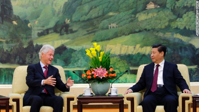 Clinton speaks to China's President Xi Jinping during a meeting at the Great Hall of the People in Beijing on November 18, 2013. 