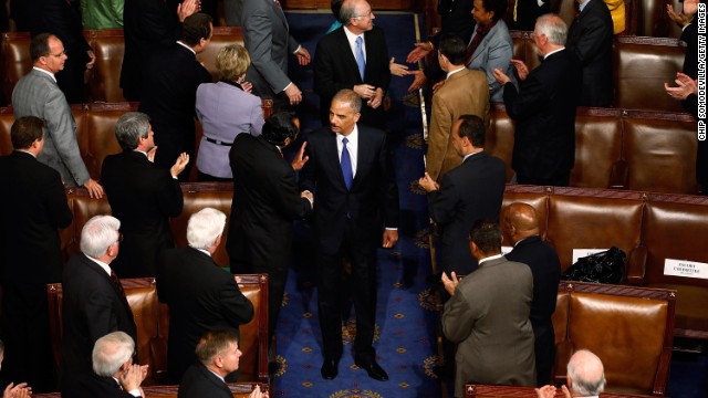 Holder is greeted by members of Congress as he arrives at the U.S. House of Representatives in May 2010.