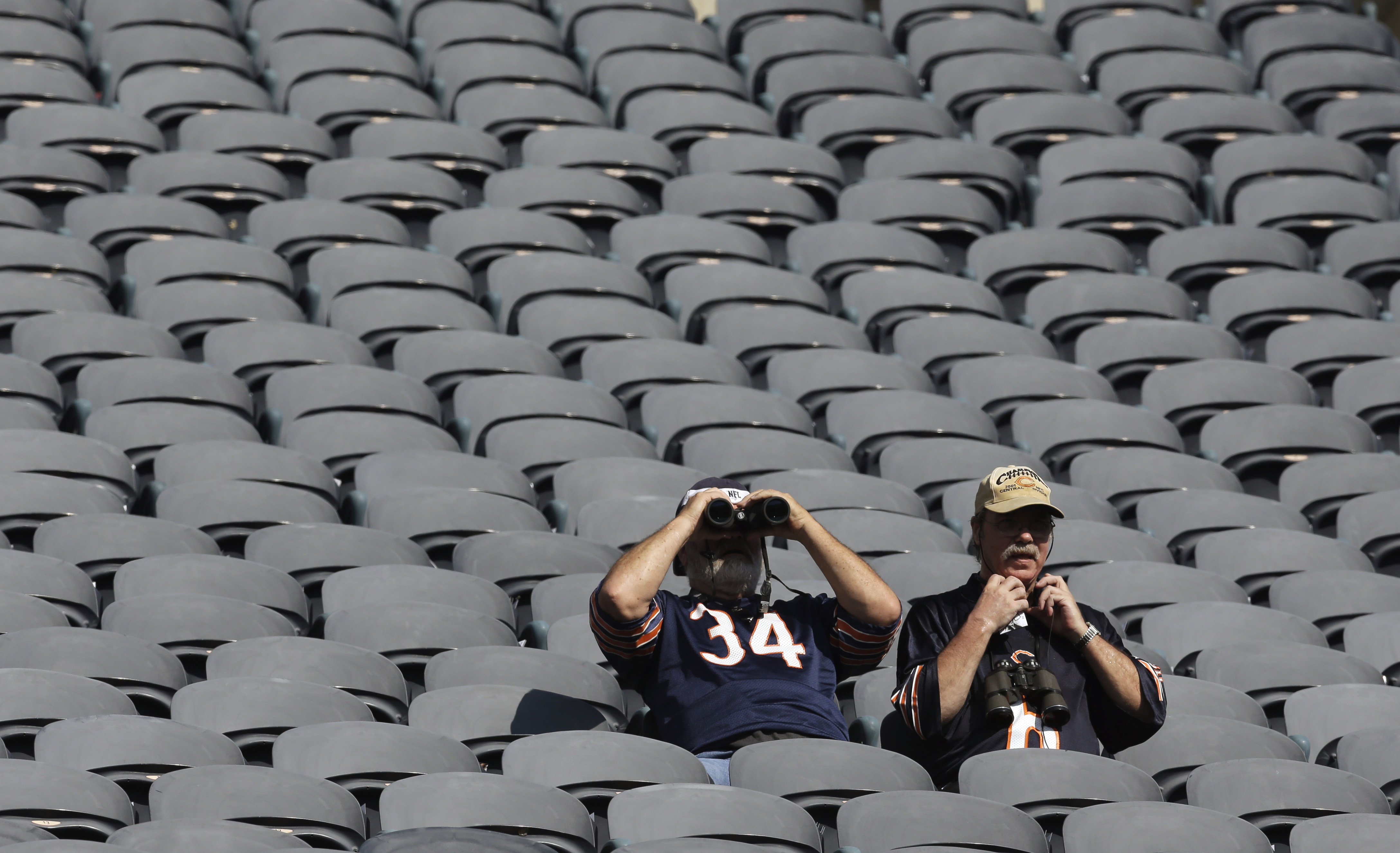 Chicago Bears fans watch the warmups before an NFL football game between the Bears and Green Bay Packers Sunday, Sept. 28, 2014, in Chicago. (AP Photo/Nam Y. Huh)