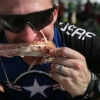 Andrew Klausner of Las Vegas, NV enjoys a turkey leg in Graettinger, Iowa on day 2 of the ride Monday, July 21, 2014. Klausner is one of 124 members with the Air Force Cycling Team.