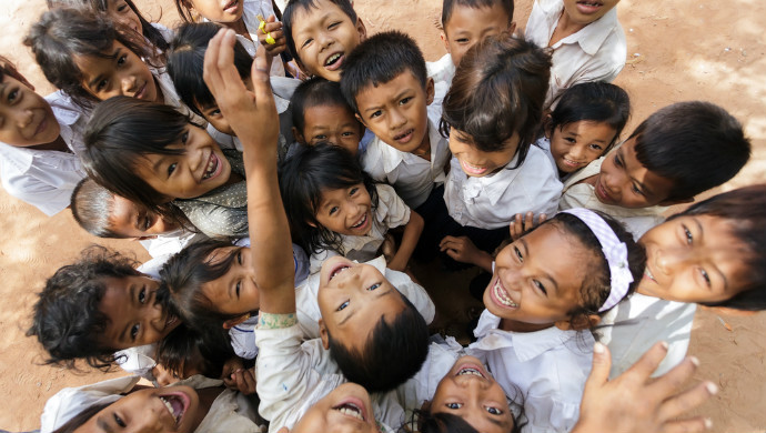 A group of children posing in a school yard in December 2012 in Siem Reap, Cambodia. (Image credit: Stephane Bidouze/Shutterstock.com)