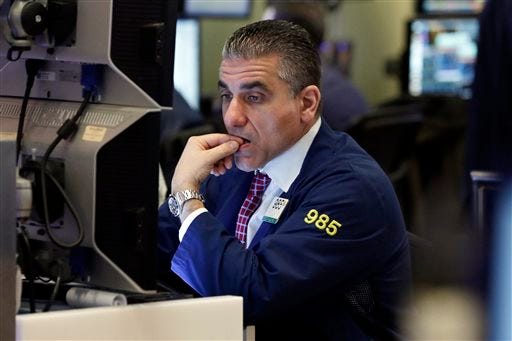 Trader Vincent Quinones works on the floor of the New York Stock Exchange, Wednesday, Dec. 2, 2015. Stocks were mixed in early trading Wednesday ahead of a European Central Bank meeting where further stimulus is expected to be announced as well as a speech by the head of the Federal Reserve. (AP Photo/Richard Drew)