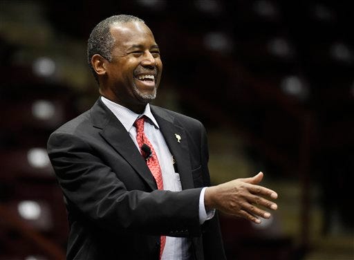 Republican presidential candidate, Dr. Ben Carson arrives on stage during a town hall meeting at Winthrop University, Wednesday, Dec. 2, 2015, in Rock Hill, S.C. (AP Photo/Rainier Ehrhardt)