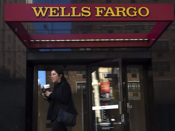 A woman exits a Wells Fargo ATM in the Manhattan borough of New York, October 10, 2015.  REUTERS/Eduardo Munoz - 
