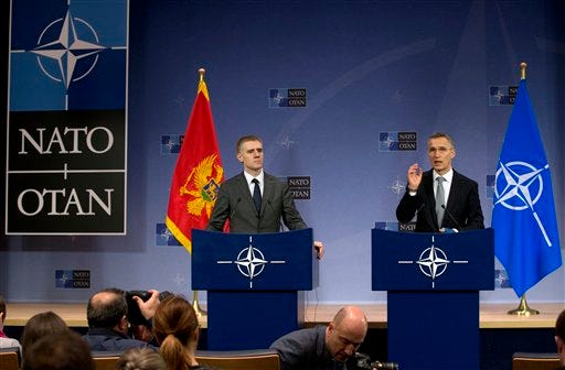 NATO Secretary General Jens Stoltenberg, right, and Montenegro's Foreign Minister Igor Luksic address a media conference at NATO headquarters in Brussels on Wednesday, Dec. 2, 2015. NATO member states have formally invited the tiny Adriatic nation of Montenegro to join the alliance in the face of Russian opposition to the move. (AP Photo/Virginia Mayo)