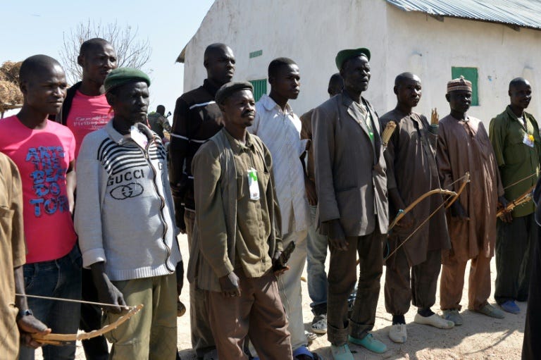 Members of a self-appointed vigilance committee tasked with hunting down and fighting Boko Haram Islamic group pictured in the village of Lding Lding, northern Cameroon, on February 16, 2015