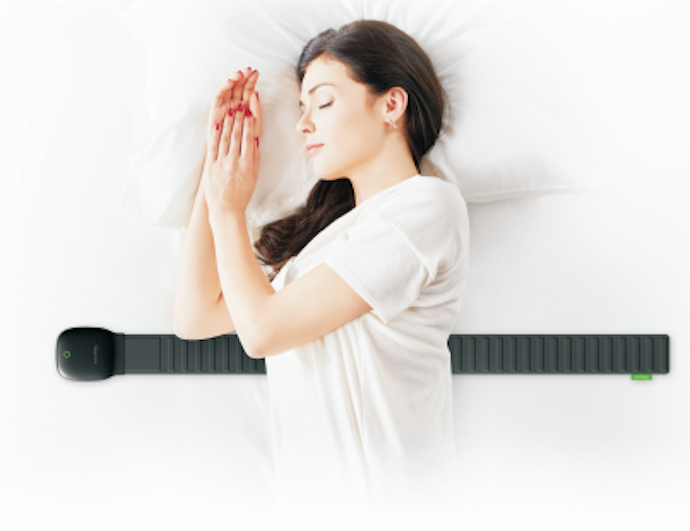 Woman sleeping with the smart sensor underneath her