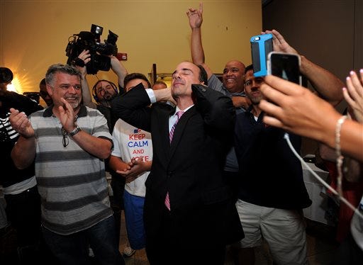 FILE - In this Wednesday, Sept. 16, 2015, file photo, former Bridgeport Mayor Joseph Ganim reacts after he enters Testo's Restaurant in Bridgeport, Conn., after winning the Democratic mayoral primary. Ganim is scheduled to take the oath of office Tuesday, Dec. 1, 2015. (Brian A. Pounds/Hearst Connecticut Media via AP, File) MANDATORY CREDIT