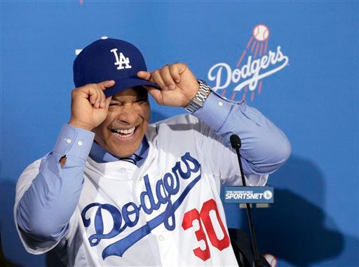 Los Angeles Dodgers Dave Roberts is officially introduced as the first minority manager in franchise history at Dodger Stadium in Los Angeles Tuesday, Dec. 1, 2015. (AP Photo/NIck Ut)