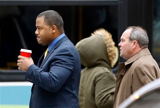 William Porter, left, one of six Baltimore city police officers charged in connection to the death of Freddie Gray, walks to a courthouse with his attorney Joseph Murtha for jury selection in his trial, Monday, Nov. 30, 2015, in Baltimore. Porter faces charges of manslaughter, assault, reckless endangerment and misconduct in office. (AP Photo/Patrick Semansky, Pool)