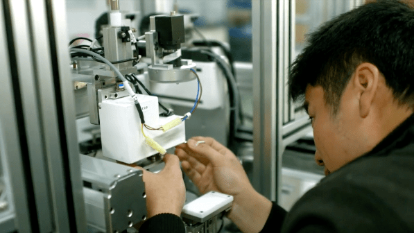An engineer works on manufacturing automation at the Zowee factory in Shenzhen.