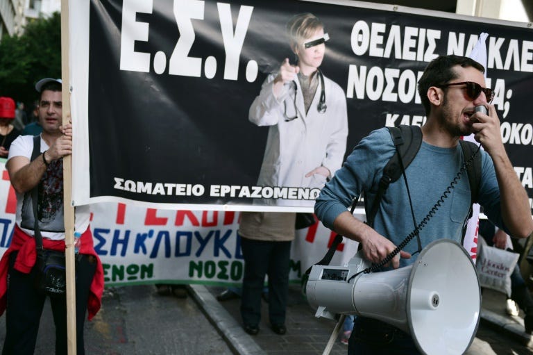 Health workers and hospital medical staff demonstrate in central Athens on December 2, 2015 to protest cutbacks and understaffing