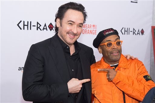 John Cusack, left, and Spike Lee attend the premiere of 