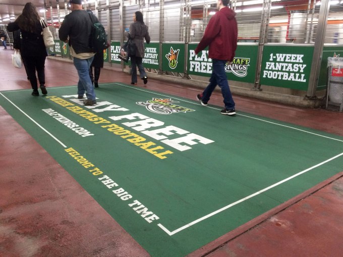 In this photo taken on Tuesday, Dec. 1, 2015, an ad for daily fantasy sports operator DraftKings is displayed in a subway station in Philadelphia. A state judge has barred daily fantasy sports sites DraftKings and FanDuel from doing business in New York.  The order issued Friday, Dec. 11, 2015, by state Supreme Court Justice Manuel Mendez also denied the country’s two biggest daily fantasy sports sites’ attempts to block the state’s attorney general enforcement action. (AP Photo/Oskar Garcia)