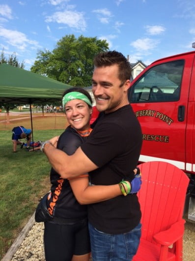 Iowa "Bachelorette" competitor Chris Soules hugs fan Claire McGuire in Strawberry Point on Saturday. Grant Rodgers/The Register