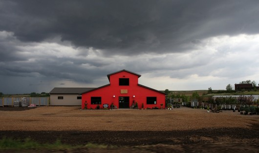 Dark clouds hang over Creative Nature nursery near a camp ground in scenic Rock Valley on Saturday, May 30, 2014. The camp ground will host thousands of RAGBRAI riders in July during the 2014 ride. (Bryon Houlgrave/The Register)