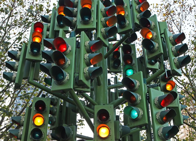A confusing traffic light system with multiple signal heads.